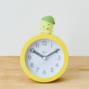 Smiski Dozing Hipper resting on an alarm clock