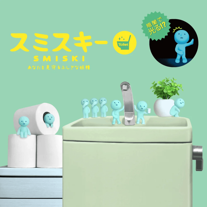 Blue Smiski Toilet Series glow-in-the-dark figures displayed around a bathroom sink