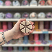 Smoked Vanilla cream segmented wax melt held in hand