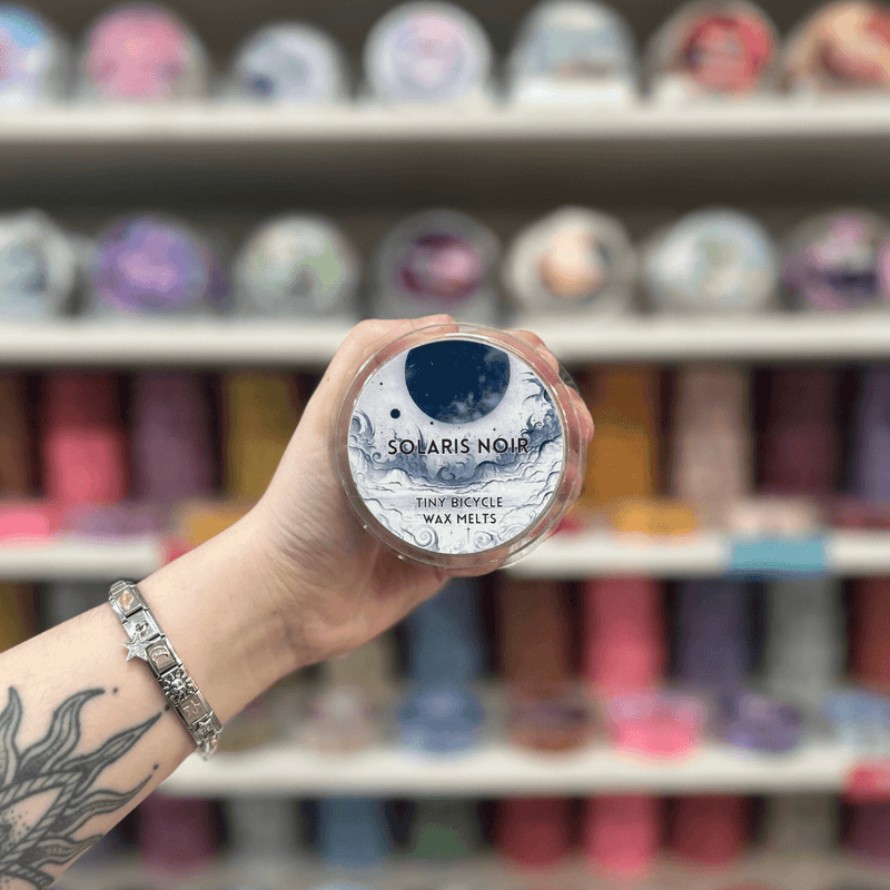 Solaris Noir wax melt pot with moon and wave label