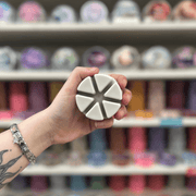 Solaris Noir white segmented wax melt held in hand