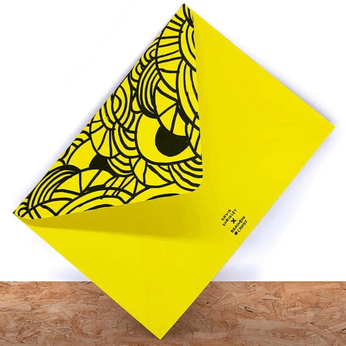 Neon yellow printed envelope with black graphic pattern for David Shrigley greeting card.

