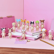 Sonny Angel Animal Series 2 figures displayed with notebooks and stationery