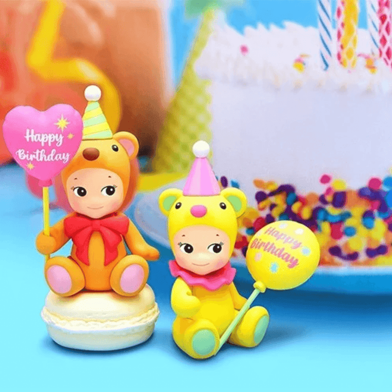 Sonny Angel Birthday Gift Bear Heart Balloon and Star Balloon mini figures displayed beside a birthday cake