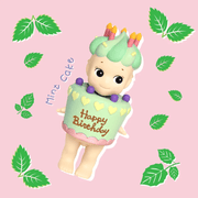 Sonny Angel Birthday Gift Mint Cake mini figure with pastel green icing, purple toppings and tiny hearts