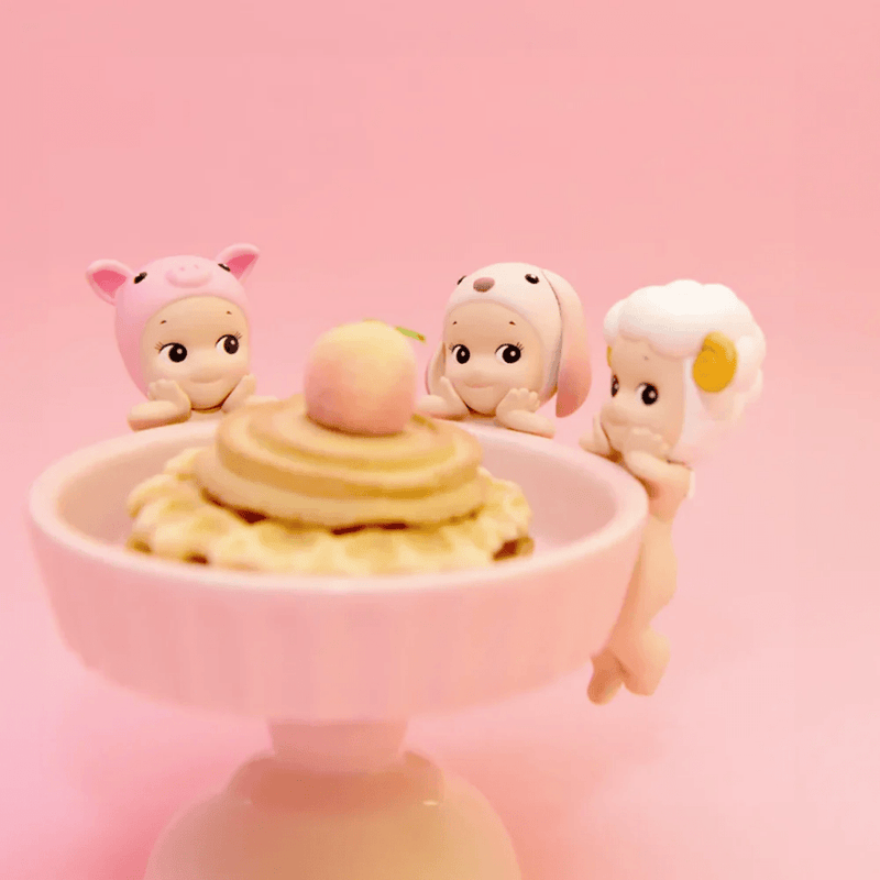 Sonny Angel Hippers Pig, Lop Ear Rabbit and Sheep figures attached to a dessert bowl