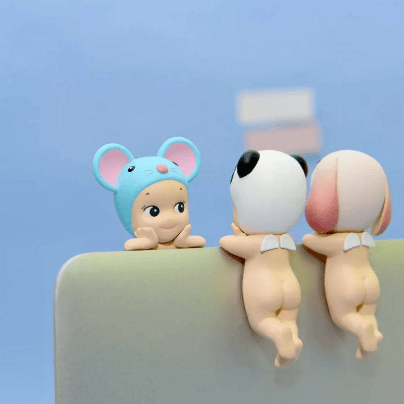 Mouse, Panda and Lop Ear Rabbit Sonny Angel Hippers attached to a laptop screen