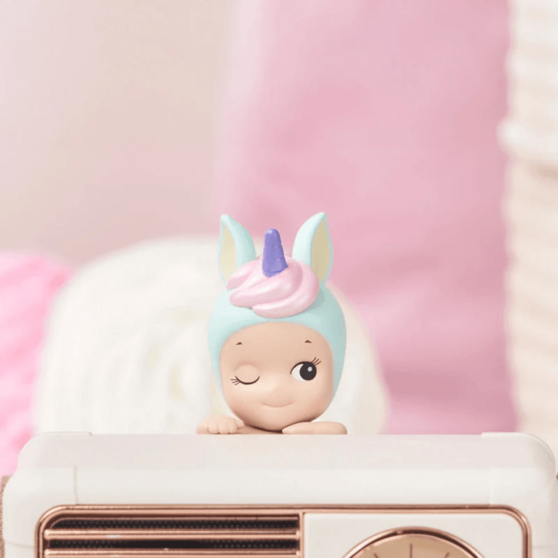 Pastel unicorn Sonny Angel Hipper displayed on a vintage radio