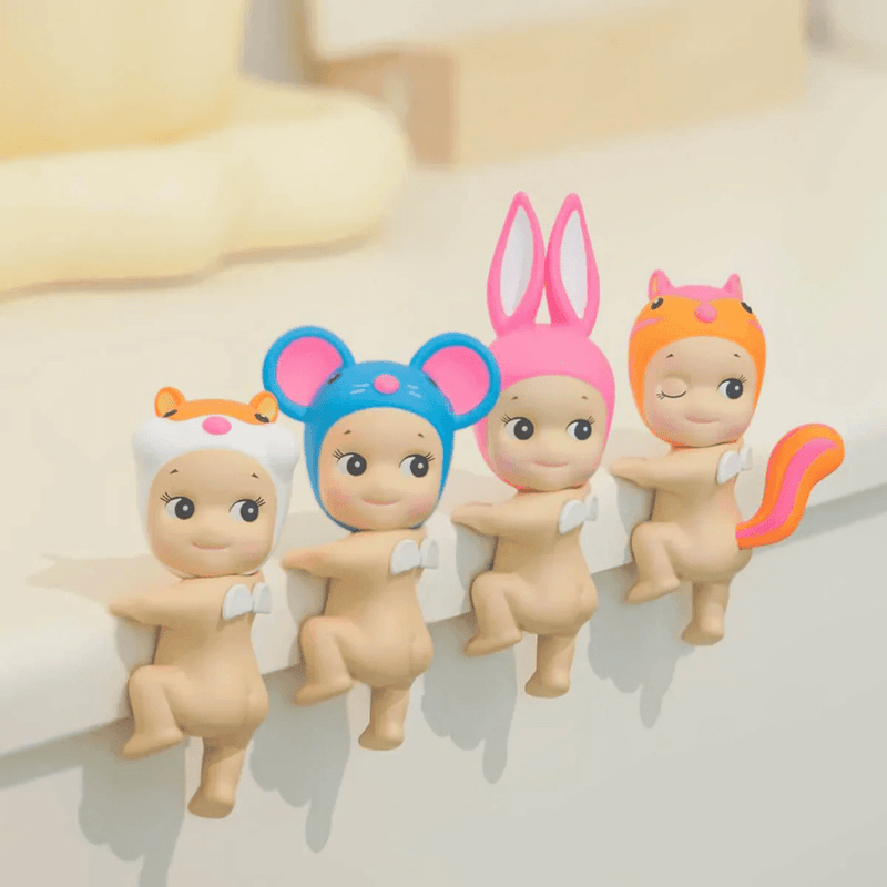Sonny Angel Hippers Looking Back animal figures attached to an edge