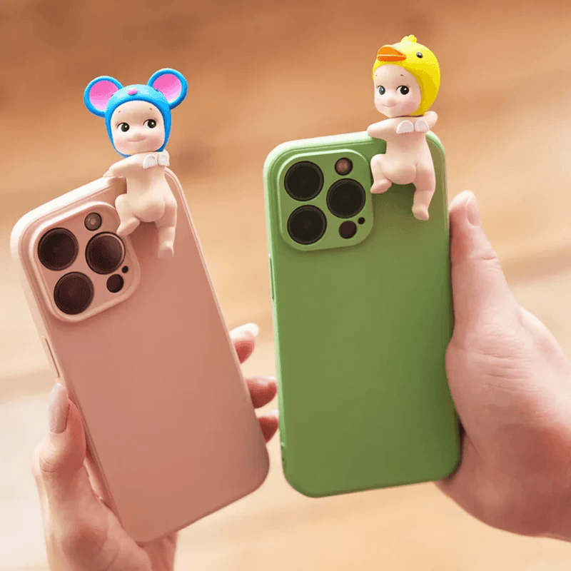 Sonny Angel Hippers Looking Back Mouse and Duck figures displayed on phones