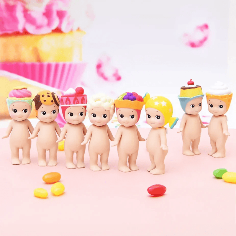 Sonny Angel Sweets Series collectable mini figures displayed together with colourful desserts