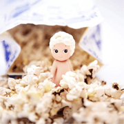 Sonny Angel Sweets Series Popcorn mini figure surrounded by fluffy popcorn