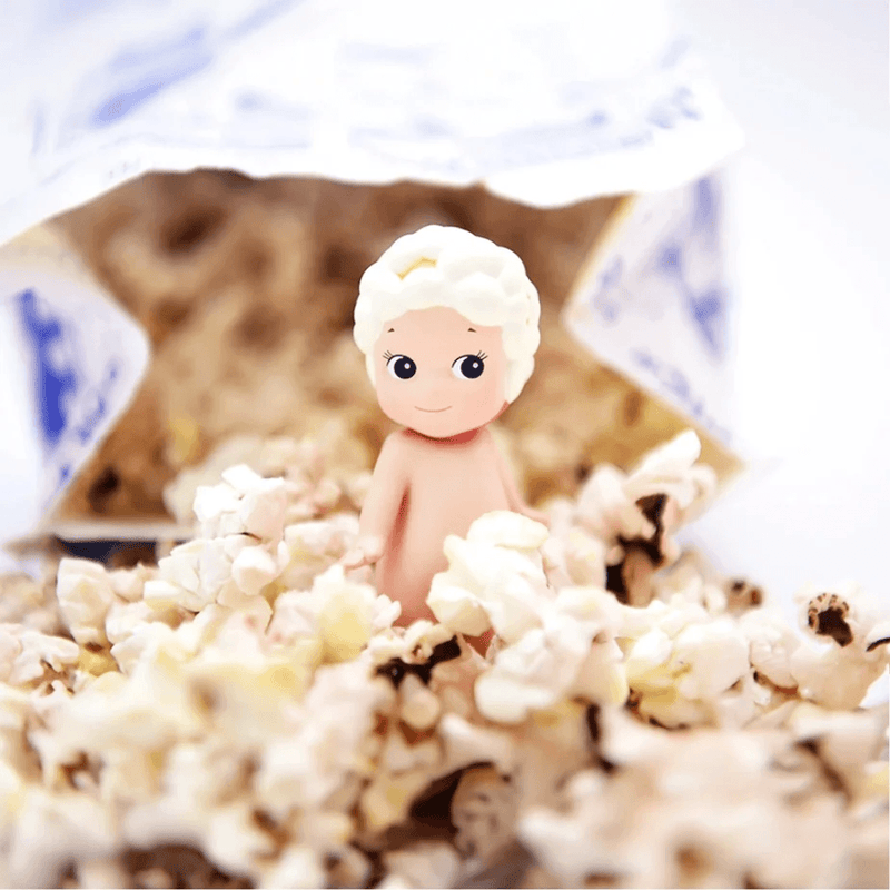 Sonny Angel Sweets Series Popcorn mini figure surrounded by fluffy popcorn