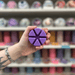 Spiced Blackberry Jam purple segmented wax melt held in hand