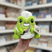 Squishable Alter Ego Frog Chef plush toy front view held in hand in a shop
