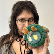 Squishable Alter Egos Bog Moth plush being held to show its compact size