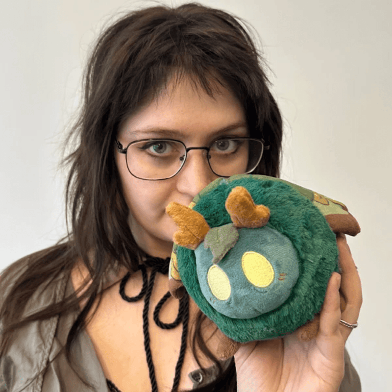 Squishable Alter Egos Bog Moth plush being held to show its compact size