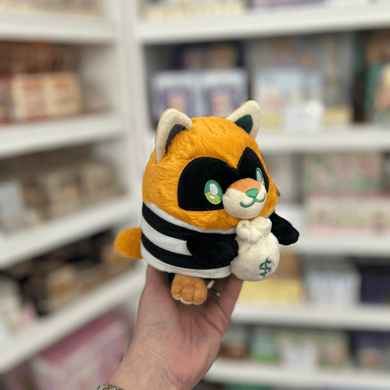 Profile view of Squishable Alter Egos Cat Burglar Kitty plush toy with orange fur, black and white stripes and soft plush finish