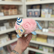 Pink side of Squishable Alter Egos Cotton Candy Kitty plush toy with blue tail, striped horn and official Squishable tag