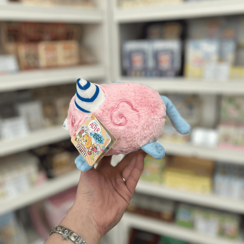Pink side of Squishable Alter Egos Cotton Candy Kitty plush toy with blue tail, striped horn and official Squishable tag