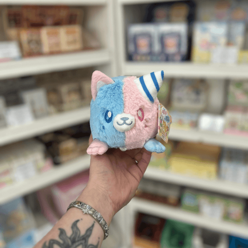 Squishable Alter Egos Cotton Candy Kitty plush toy with half blue, half pink fur, cat ears and striped horn