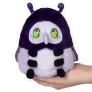 Front view of Squishable Plague Doctor Bug plush with green eyes and purple hood