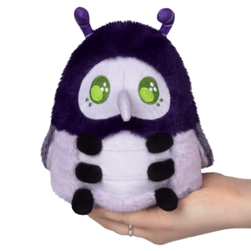 Front view of Squishable Plague Doctor Bug plush with green eyes and purple hood
