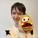 Person holding Squishable Alter Egos Plague Doctor Burger plush toy for size reference