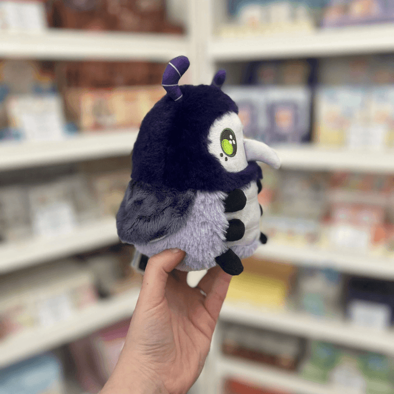 Squishable Alter Egos Series 17 Plague Doctor Bug plush toy held in hand, side view