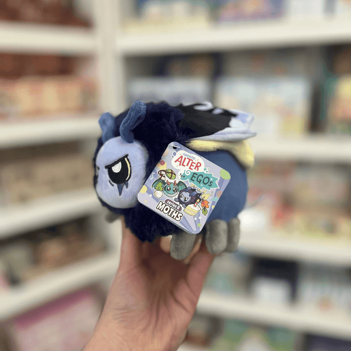 Squishable Alter Egos Series 8 Metal Moth plush toy held in hand with tag visible