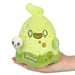 Front view of Squishable Slime Ghost plush in neon green with skull accessory, held in hand