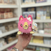 Squishable Alter Egos Strawberry Kitty plush toy with pink fur, yellow face details, cat ears and white flower