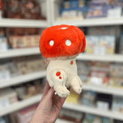Squishable Alter Egos Toadstool plush toy held in hand, side view