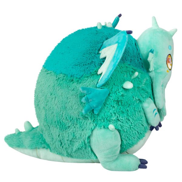 Side profile highlighting tentacles, horns and chubby round body of Baby Cthulhu plush.