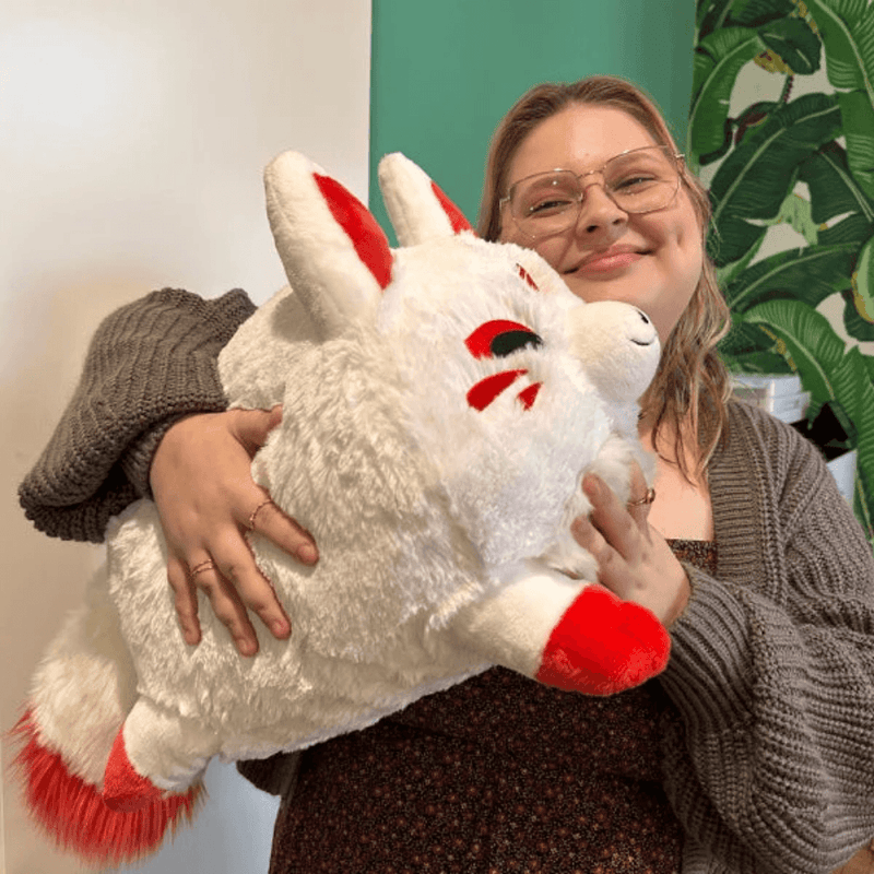Squishable Baby Kitsune fox plush being cuddled