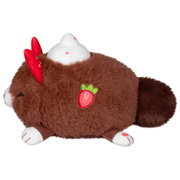 Side view of the Cocoa Kitsune plush showing its embroidered strawberry detail