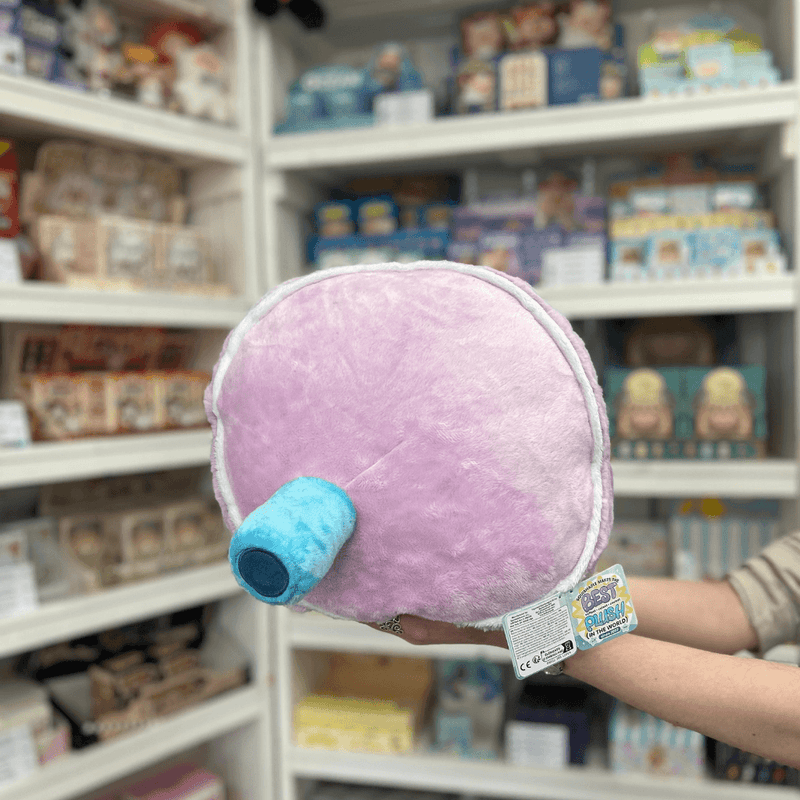 Squishable Comfort Food Bubble Tea plush toy held in hands in a gift shop, back view