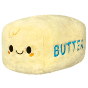 Squishable Comfort Food Butter plush with yellow fur, smiling face and blue BUTTER lettering