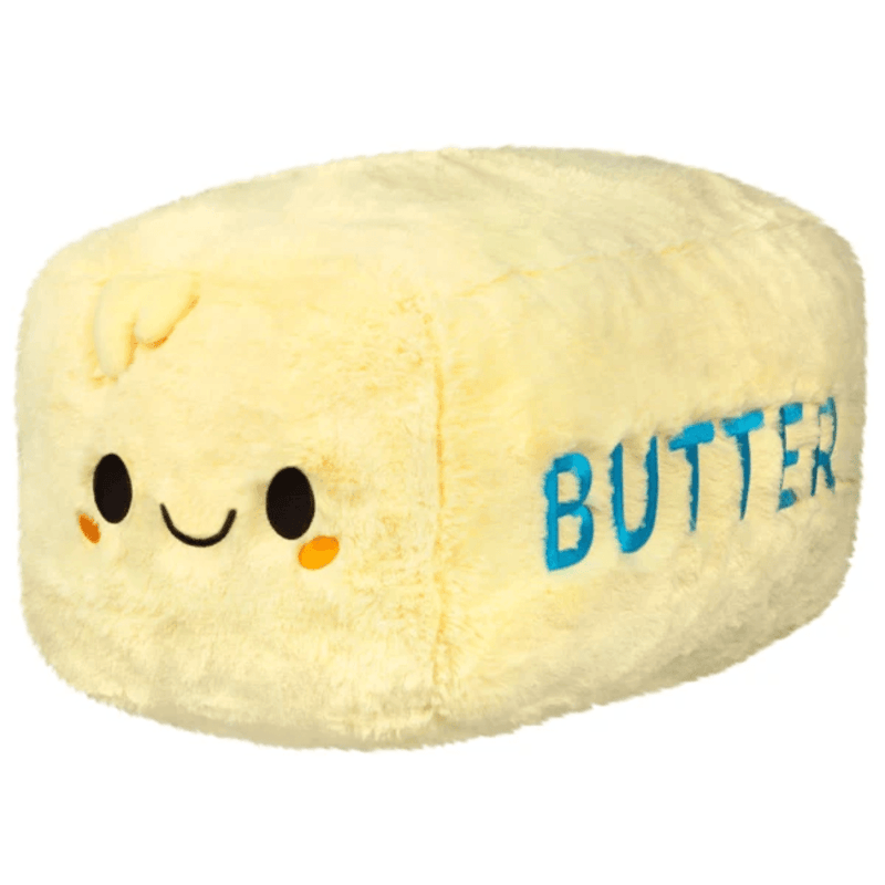 Squishable Comfort Food Butter plush with yellow fur, smiling face and blue BUTTER lettering