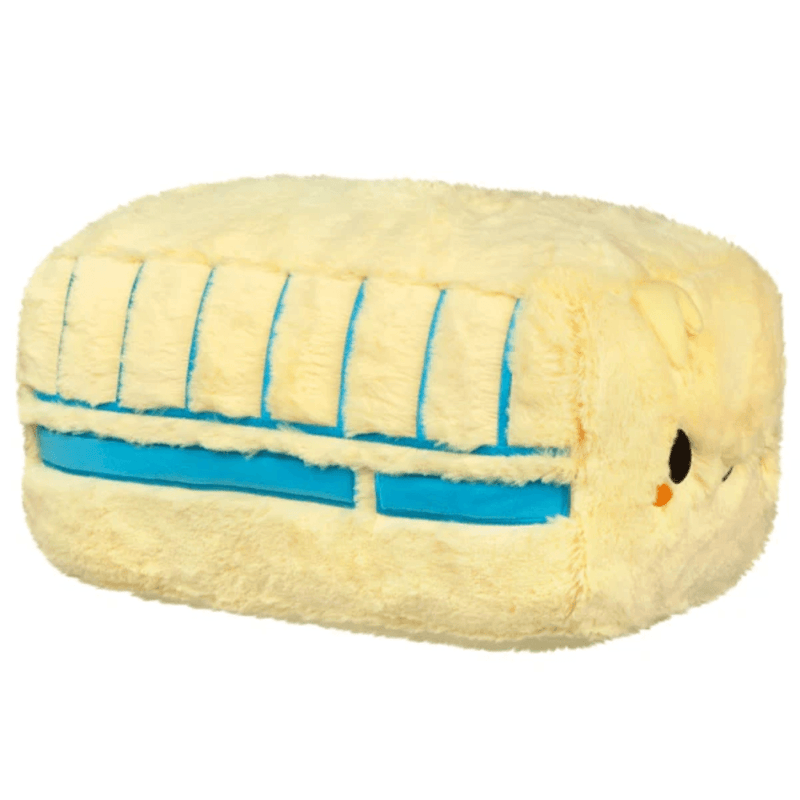 Side view of Squishable Butter plush showing blue wrapper stripes and fluffy yellow body