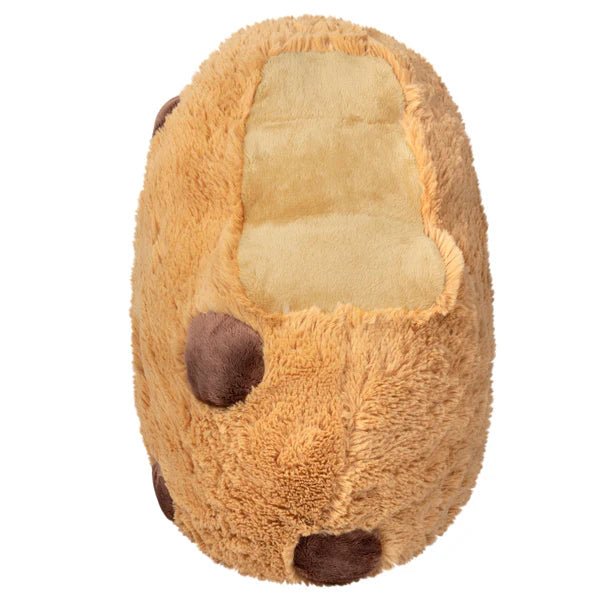 Side view of the Squishable Cookie plushie showing a plush bite and soft interior design.