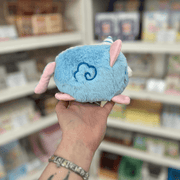 Blue side view of Squishable Alter Egos Cotton Candy Kitty plushie with embroidered swirl detail, pink ears and pastel tail