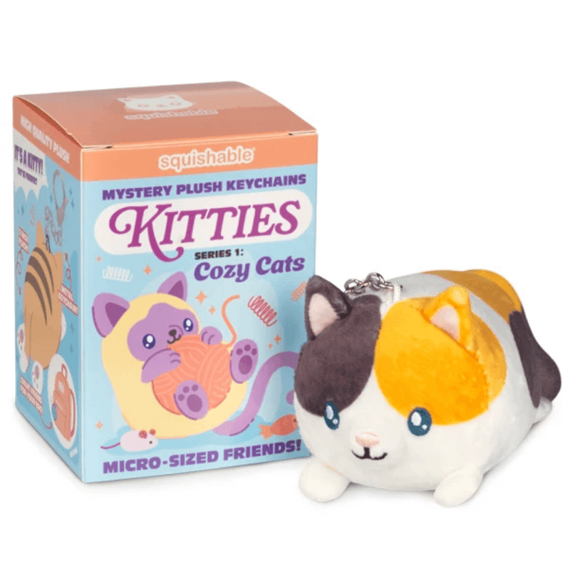 Squishable Cozy Cats Blind Box shown beside an example Calico plush keychain
