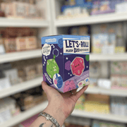 Side view of Squishable Let's Roll D20 Keychain Blind Box showing plush dice keychain artwork and colourful packaging