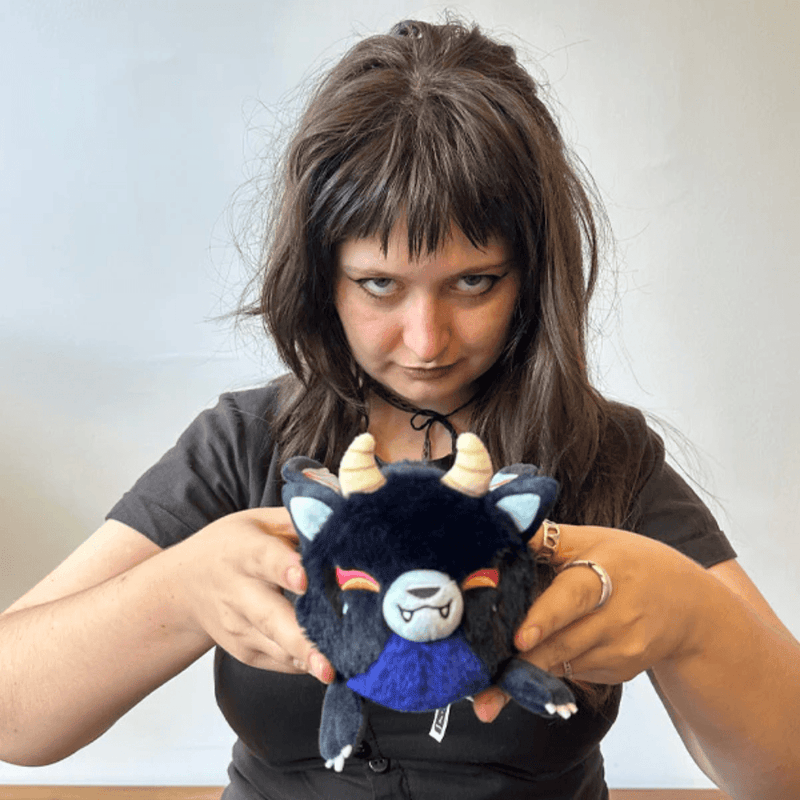 Person holding the Squishable Alter Egos Demon Kitsune plush toy