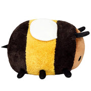 Side view of the Squishable Fuzzy Bumblebee plushie with soft yellow and black stripes and white plush wings.