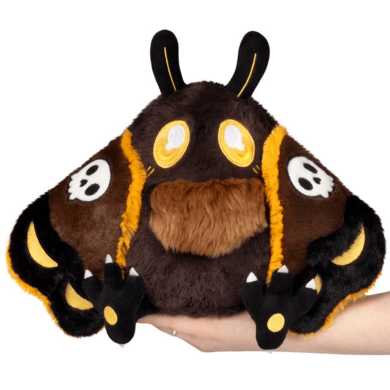Mini Squishable Hawkmothman plush front view with skull-patterned wings
