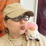 Person posing with the Squishable Alter Egos Ice Cream Spider plush toy