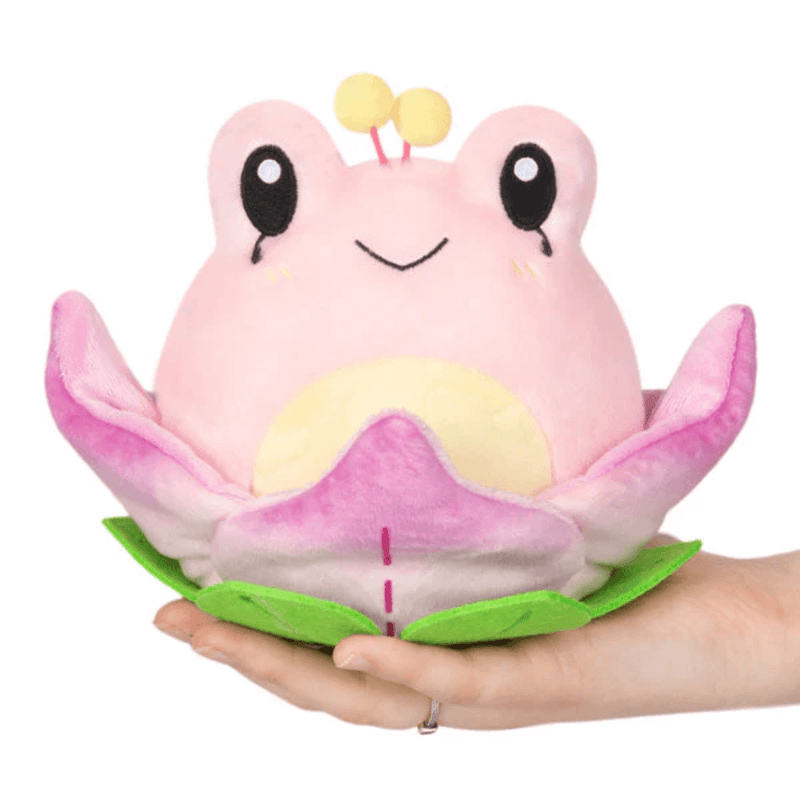 Front view of Squishable Alter Egos Lotus Frog plush toy sitting in lotus petals