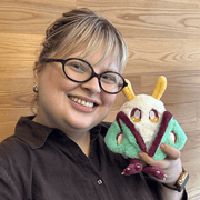 Squishable Alter Egos Luna Mothman plush being held